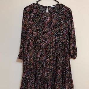 En creme Black floral ruffle dress